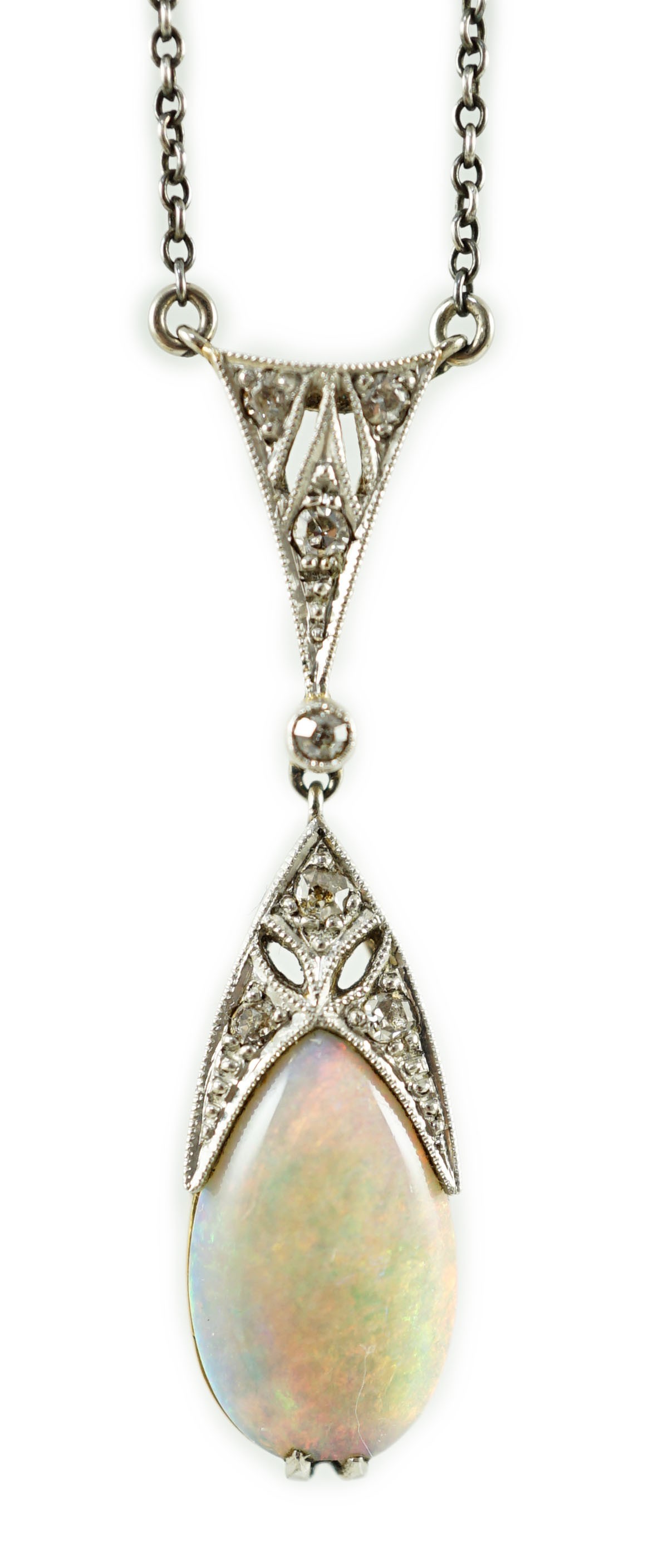 A 1920's gold and platinum, white opal and millegrain set diamond cluster pear shaped drop pendant necklace